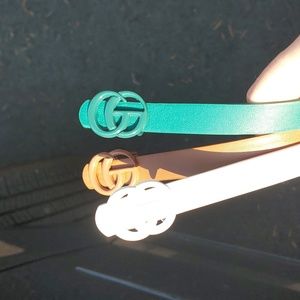 3 belts. Teal. White. Cognac